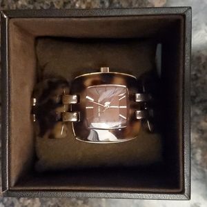 Michael Kors Tortoise shell watch with rose gold accent.